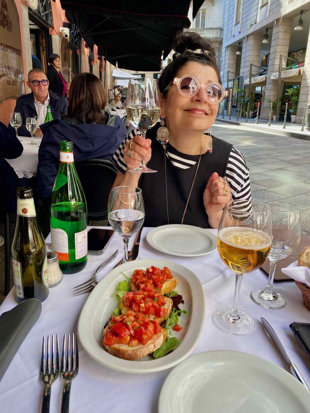 Soula enjoying a Milanese bruschetta and Prosecco